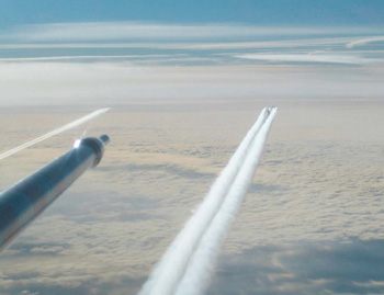 probe and two contrails across the sky