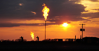 flares burning at sunset