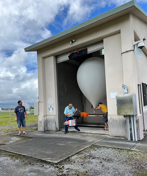 balloon and payload coming out of garage