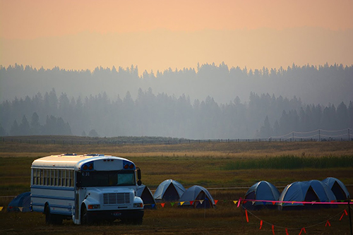 fire camp site hazed in smoke